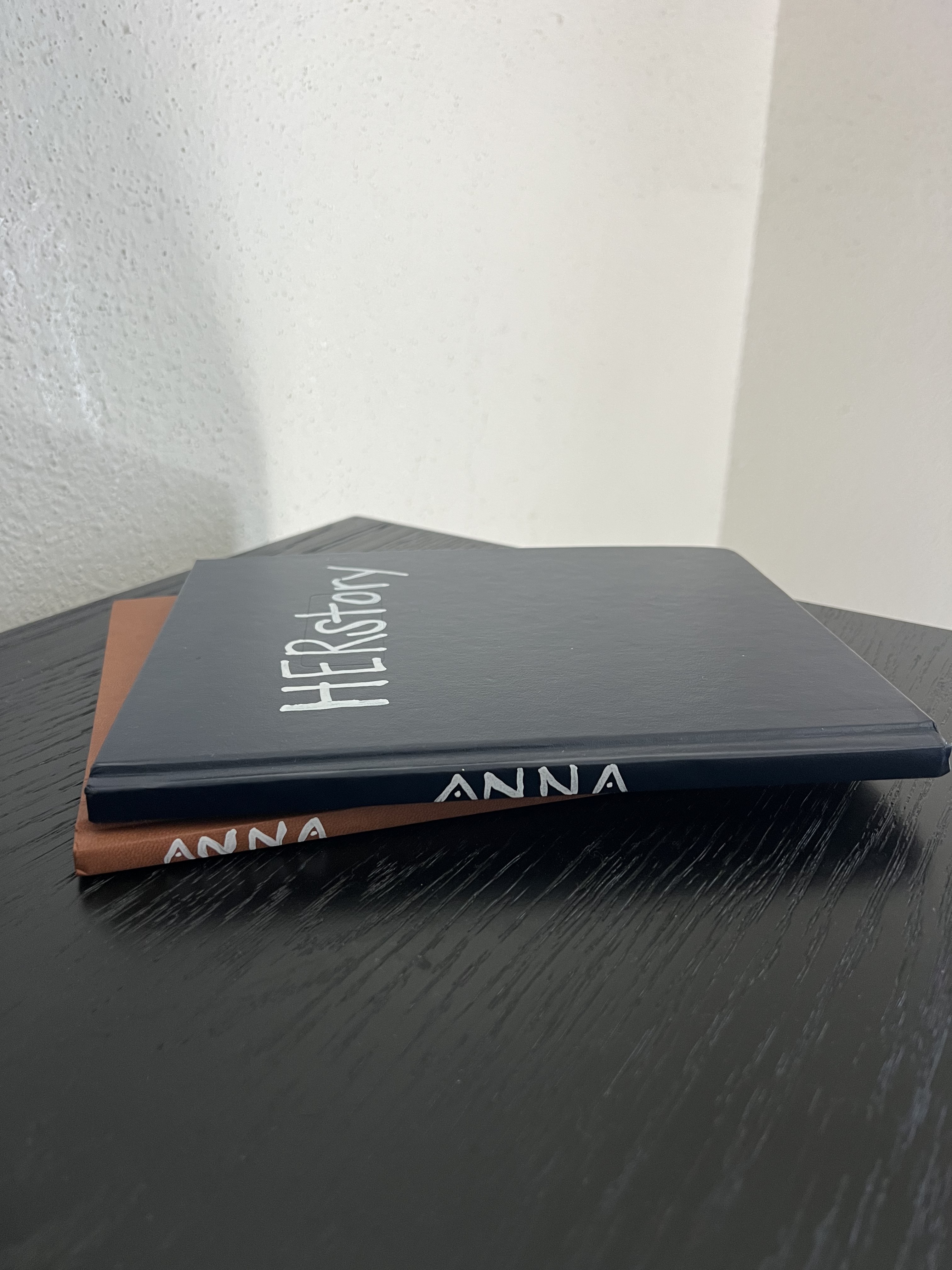 The founder's journals, including one titled HER story